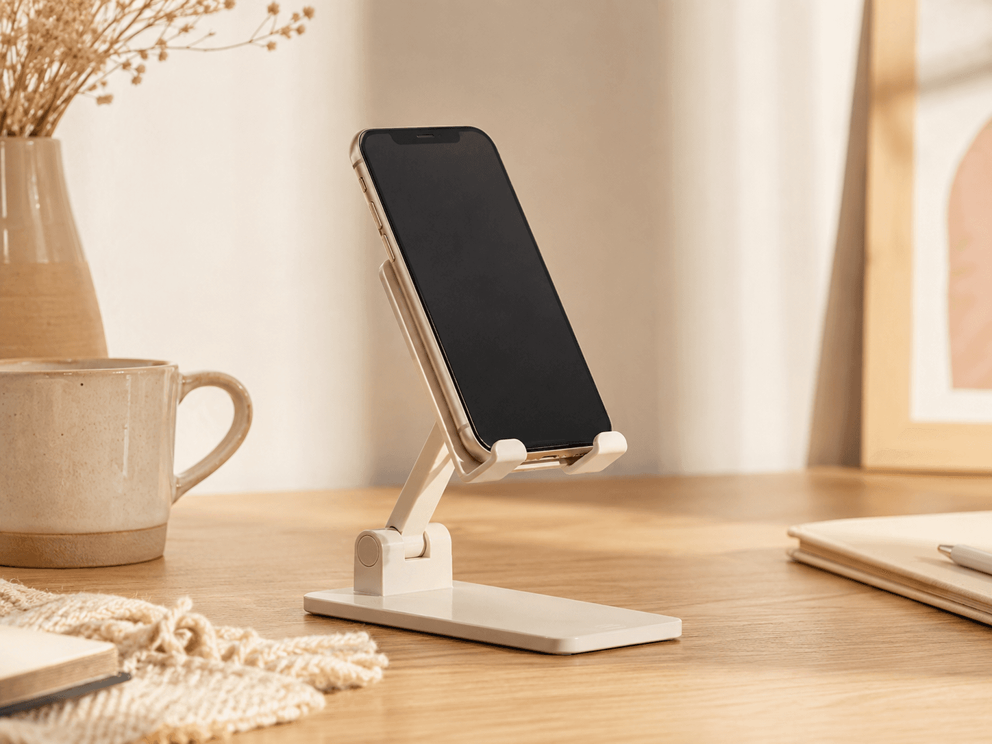 Phone grip stand supporting a mobile phone